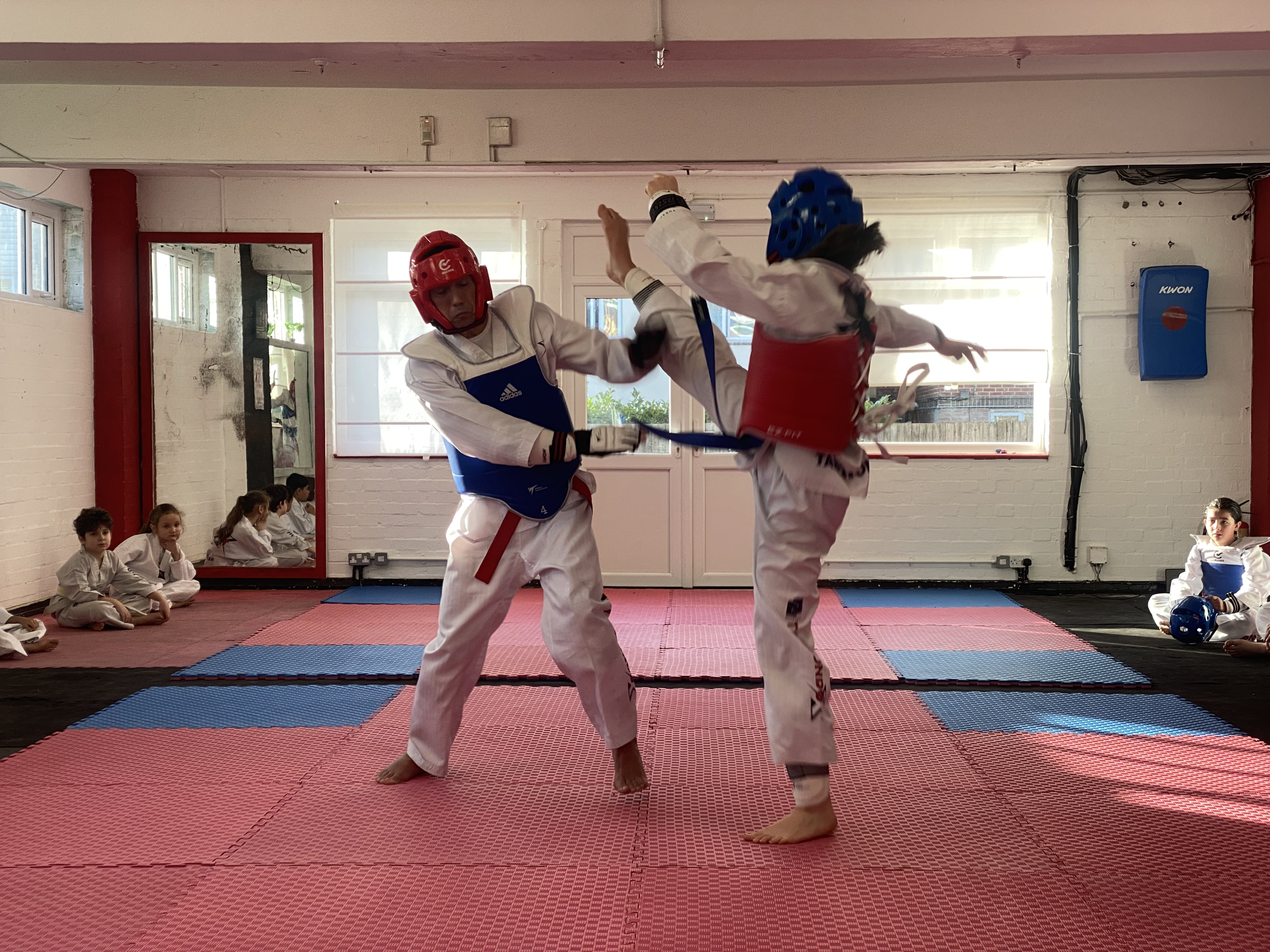 Taekwondo X students practising sparring in Cricklewood.